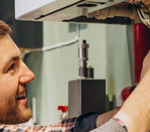 Young engineer adjusting autonomous heating