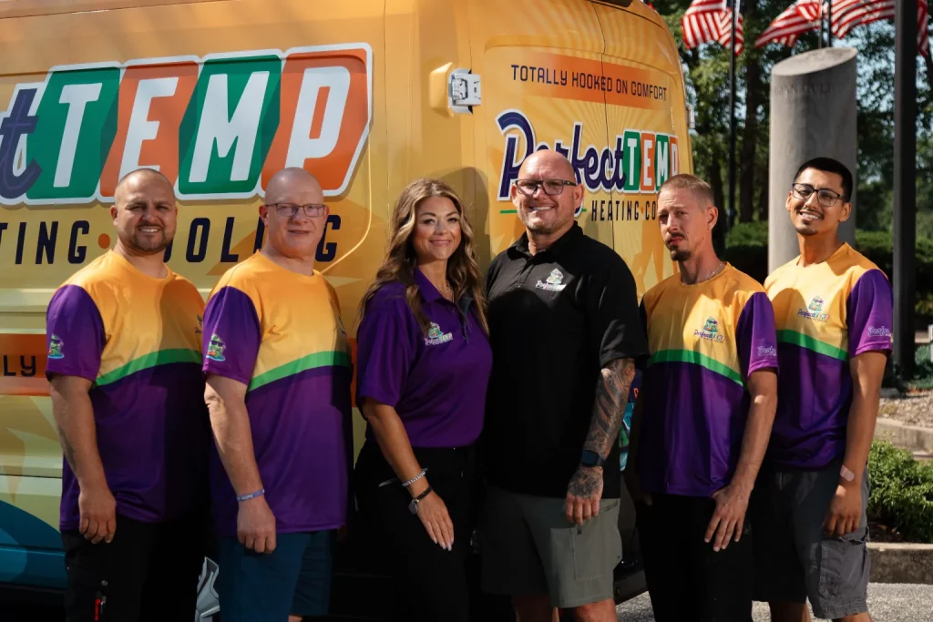 close up of team and van