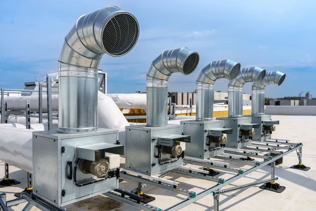 hvac units and ductwork on a commercial building roof